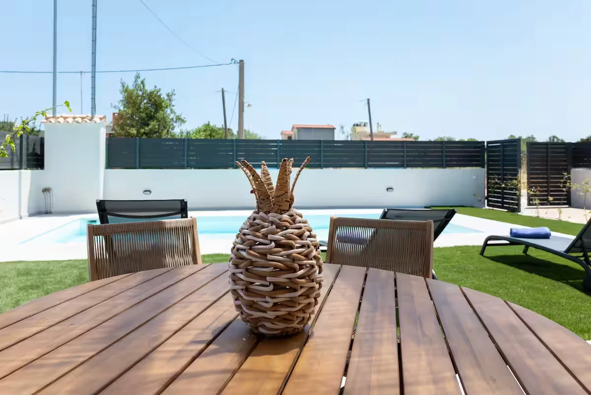 Elegant master bedroom with large window and warm lighting in villa in Schinias, Attica