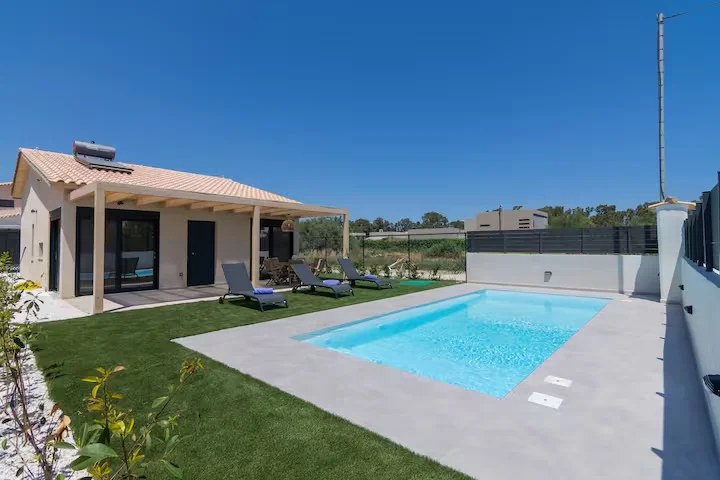 Exterior view of the luxury villa at twilight in Schinias, East Attica